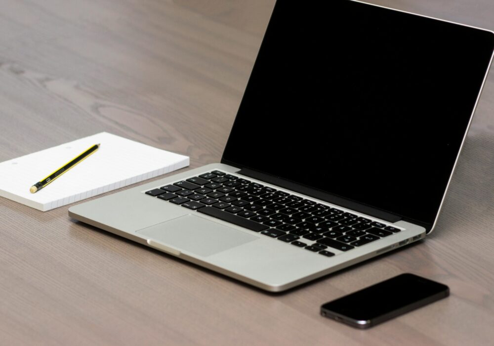 Free Silver Macbook Beside Iphone Stock Photo