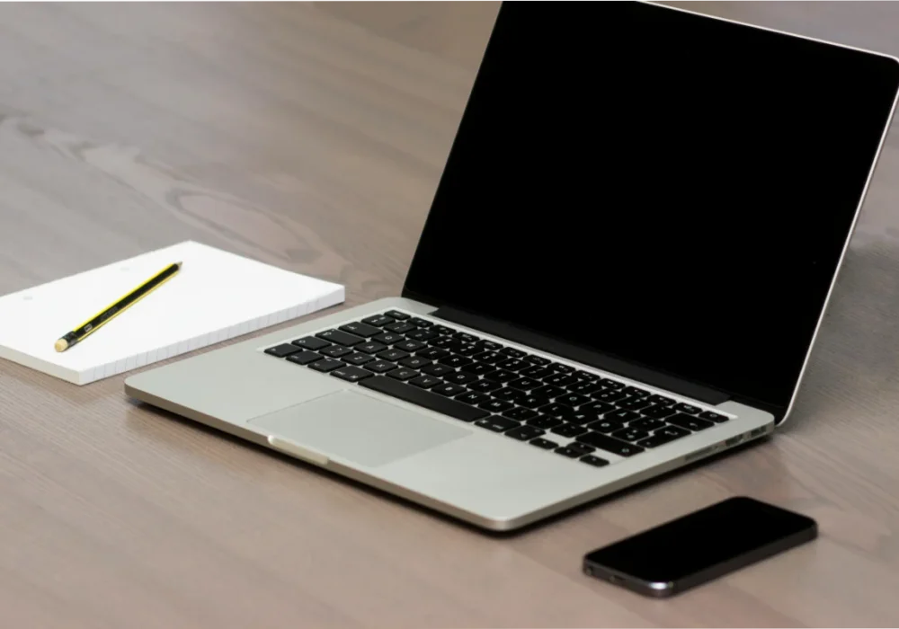 Silver Macbook Beside Iphone