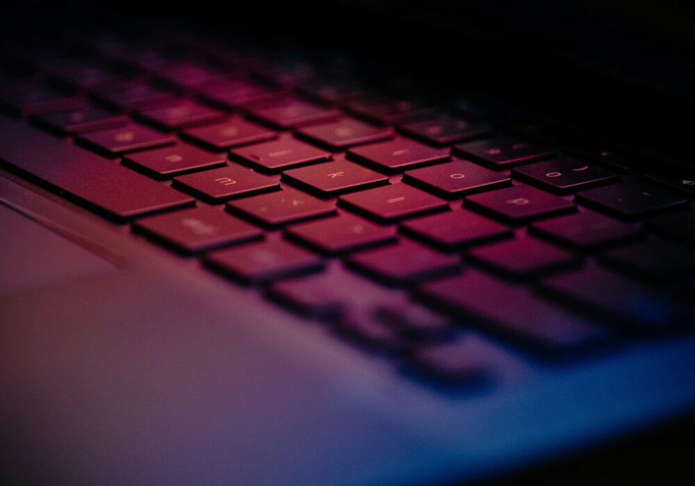 a-close-up-of-a-keyboard-with-a-blurry-background