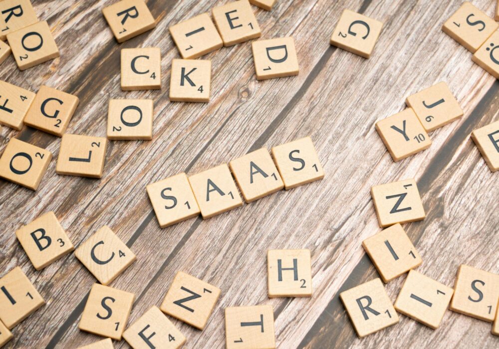 scrabble-letters-spelling-saas-on-a-wooden-tabl